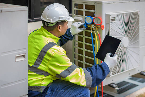 Professional Heat Pump Repair technician working in Perkins, OK